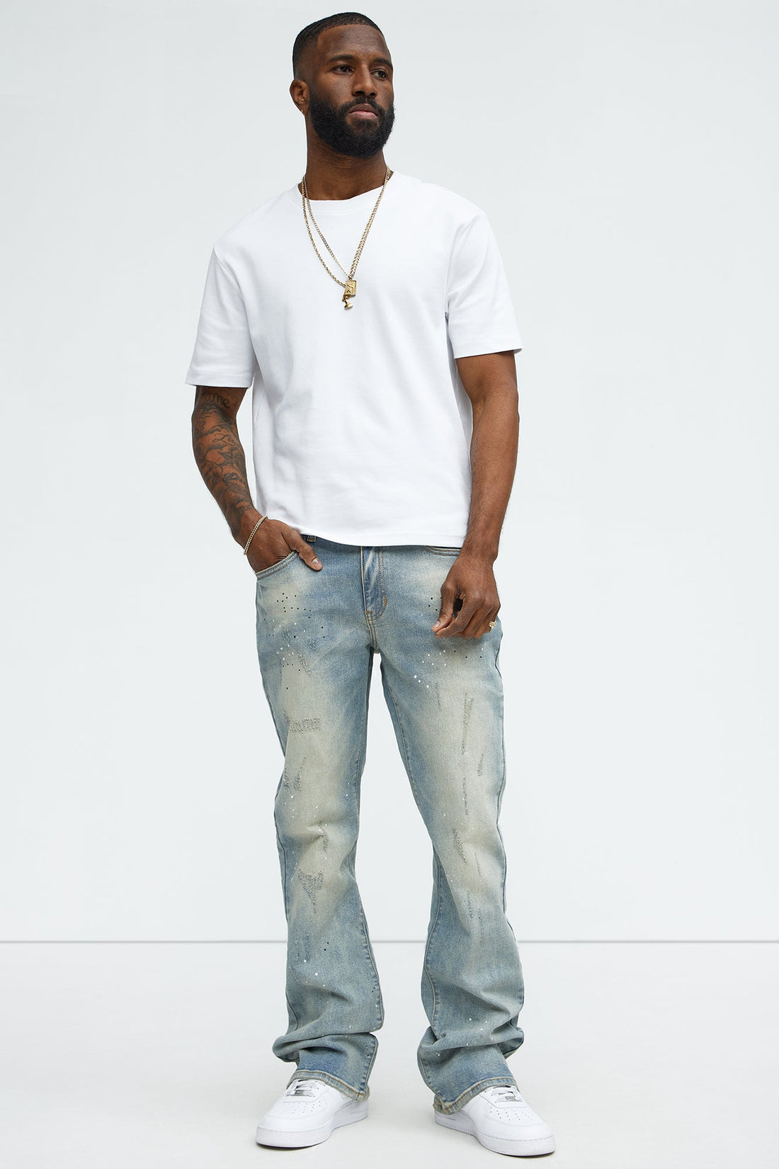 Ripped And Bleach Splatter Stacked Slim Flare Jeans - Light Blue Wash