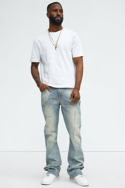 Ripped And Bleach Splatter Stacked Slim Flare Jeans - Light Blue Wash