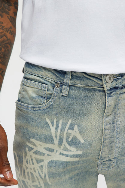 Graffiti Art Stacked Skinny Jeans - Light Wash