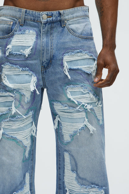 Worn All Over Distressed Baggy Jeans - Light Wash